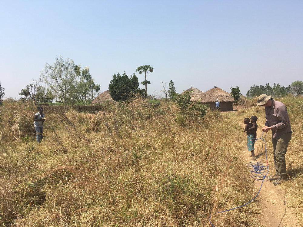  Running a resistivity survey through the village. 