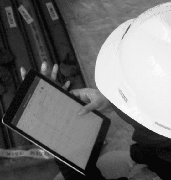 A worker uses Seequent's MX Deposit data management platform to collect, manage, and share drilling and sample data.