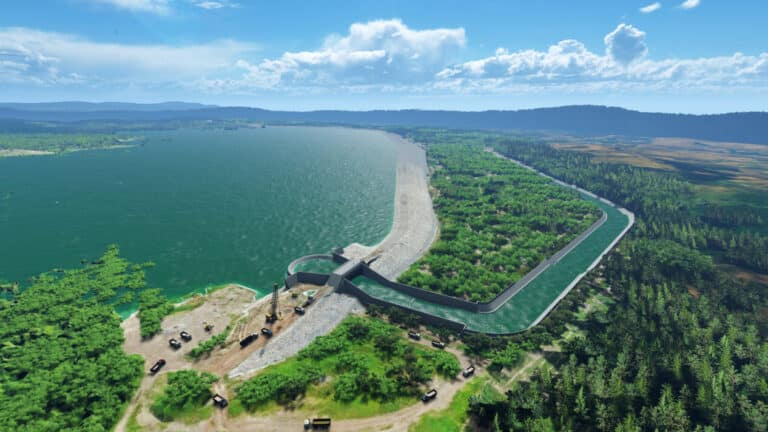 an arial photo of the Semantok Dam, with the dam water on the left and the forest on the right