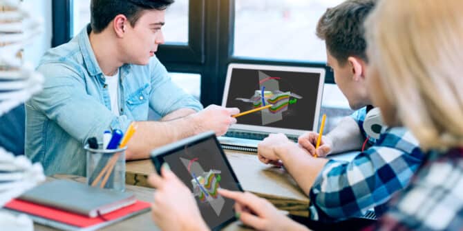 a photo of a group of students looking at Visible Geology geological models on their screens