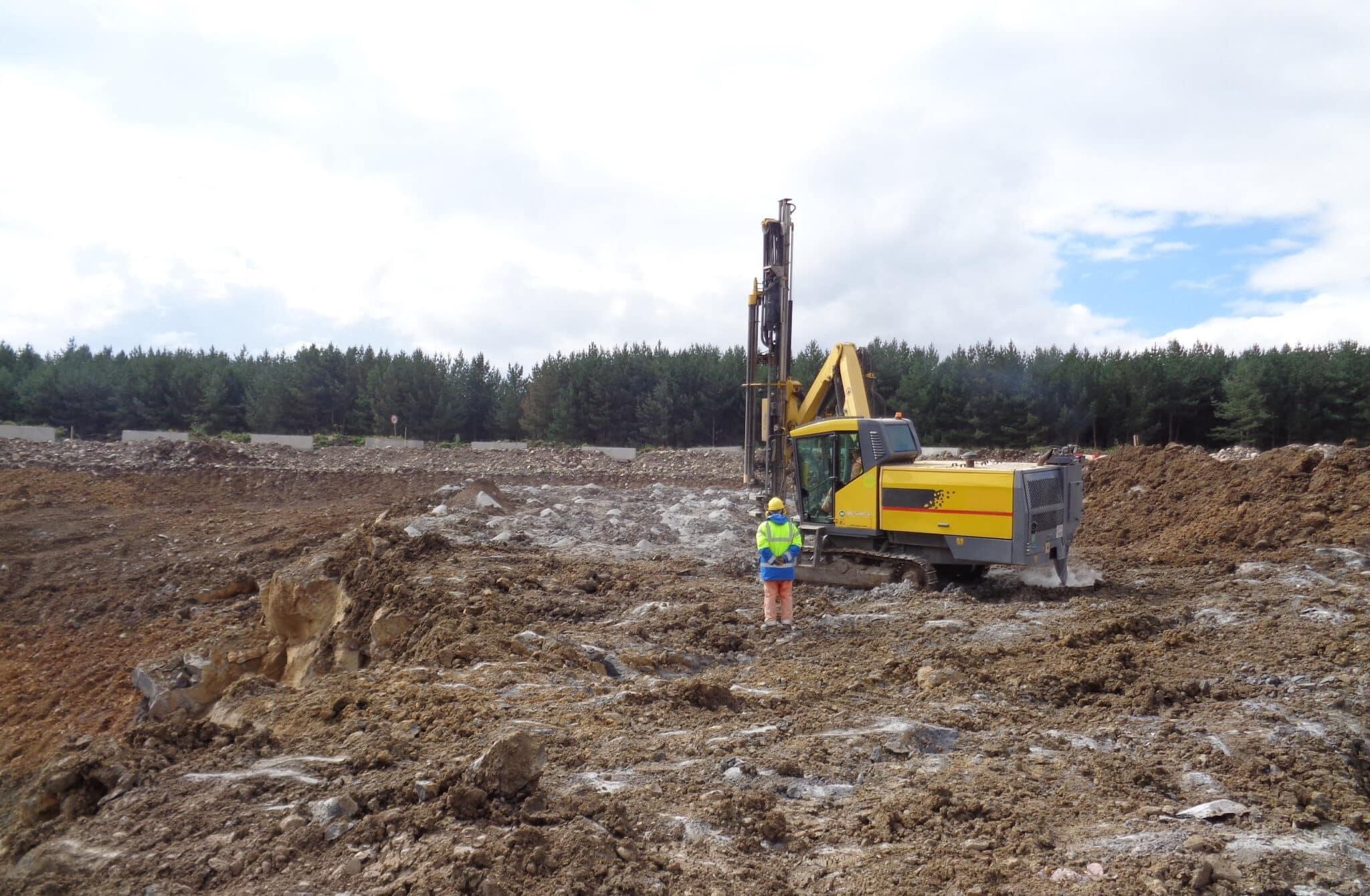 Hydraulic rock drill works during a highway / road construction project