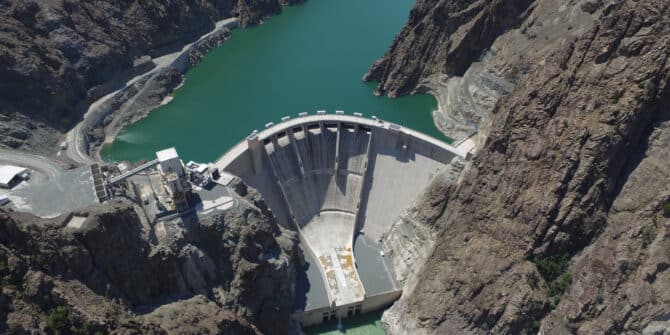 an arial photo of the Yusufeli dam built on the Çoruh River in Artvin