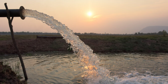 water flow from pipe , sunset